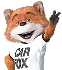 CARFAX Canada's mascot, CAR FOX, smiling and holding up the peace sign with two fingers.